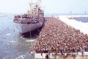 An image of migrants unloaded from a boat in the Mediterranean